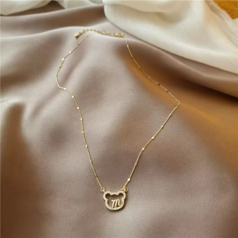 simple letter M in a little bear necklace